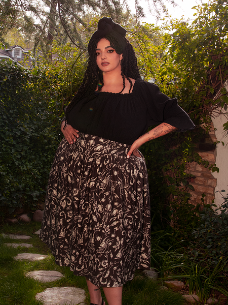 This piece wears like poetry—fluid, haunted, and undeniably beautiful.