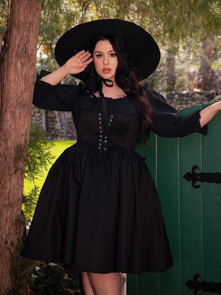 A black canvas for silver jewelry and dark red lips—your wardrobe’s enchanting essential.