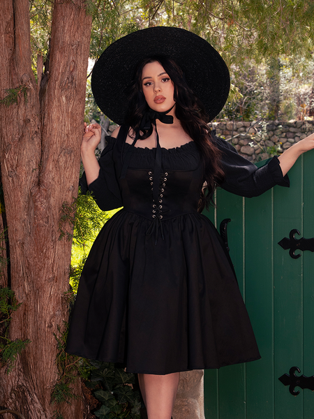 Designed for dusky gardens and echoing halls, this top is both grounded and ghostly.