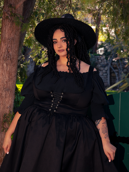 Lush and breathable, the black viscose flows with each step, evoking enchantment and ease.