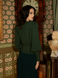 Indulge in Victorian refinement with this hunter green cardigan—crafted with a structured fit, intricate knit detailing, and a whisper of dark, romantic nostalgia.