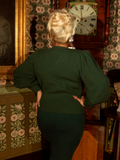 Romantic yet practical, this Victorian knit cardigan drapes effortlessly with its soft fabric, bishop sleeves, and high-neck detail, making it perfect for layering in colder months.