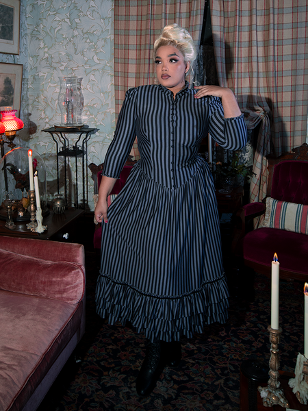 Step into old-world charm with the Victorian Dress in Black and Gray Stripes, featuring a striking striped pattern, lace detailing, and a beautifully tailored silhouette for an authentic period-inspired look.