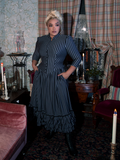 The Victorian Dress in Black and Gray Stripes blends gothic romance with classic Victorian fashion, boasting puffed sleeves, a high collar, and cascading layers of fabric for a dramatic effect.
