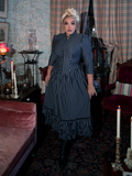 A beautifully tailored Victorian Dress in Black and Gray Stripes, featuring a structured silhouette, ruffled lace embellishments, and a striking color palette for a timelessly elegant look.