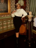 Inspired by Victorian adventuresses, this ivory pullover features dramatic sleeves and delicate knit textures, balancing function with an air of gothic romance.