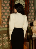 Step into history with this ivory Victorian pullover—its regal bishop sleeves and structured fit make it a striking yet wearable piece for any occasion.