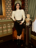 Perfect for crisp autumn mornings and candlelit evenings, this ivory cycling pullover envelops you in warmth while capturing the spirit of gothic romance.