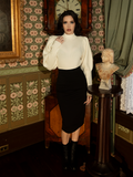 Whether for cycling, strolling, or storytelling, this ivory pullover brings Victorian sensibility to modern wardrobes with its regal cut and intricate knit.