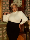 The essence of romantic adventure, this ivory cycling sweater boasts a high collar, pleated sleeves, and a tailored fit—ideal for gothic dreamers on the move.