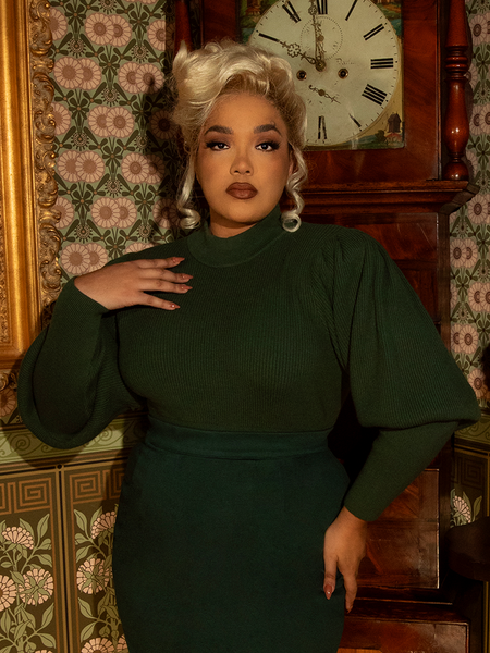 Perfect for brisk rides or cozy evenings, this Victorian cycling sweater boasts an elegant high neckline, romantic pleats, and a soft, warm embrace of hunter green.