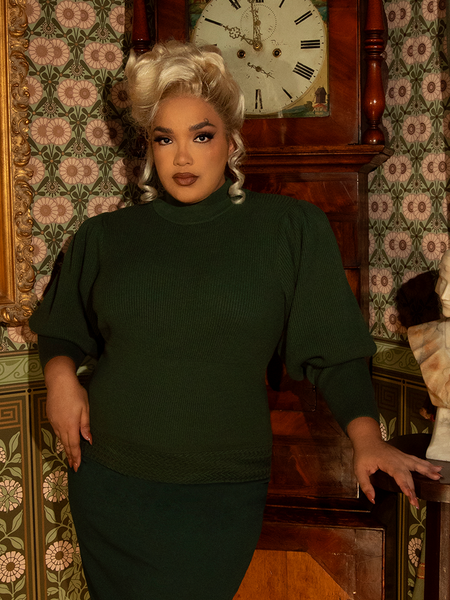 Ride in style with this Victorian-inspired pullover, crafted in a deep hunter green knit. Its puffed sleeves and tailored fit evoke vintage sophistication.