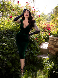 Full length shot of Micheline Pitt posing in an all new goth dress with matching elbow length gloves from La Femme en Noir.