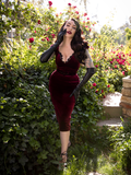 The Baudelaire Wiggle Dress in Oxblood from La Femme en Noir being worn by Micheline Pitt.