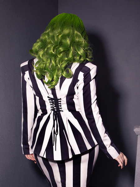 Bring gothic flair to life with the BEETLEJUICE™ Corset Blazer. Its striking monochrome stripes and structured fit exude spectral power.