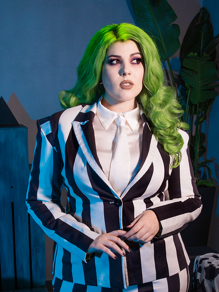 The BEETLEJUICE™ Striped Corset Blazer transforms gothic aesthetics into commanding elegance, boasting pinstriped tailoring and corset-inspired charm.