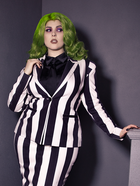 This BEETLEJUICE™ Corset Blazer captures gothic precision with its tailored pinstripes and hauntingly elegant silhouette.