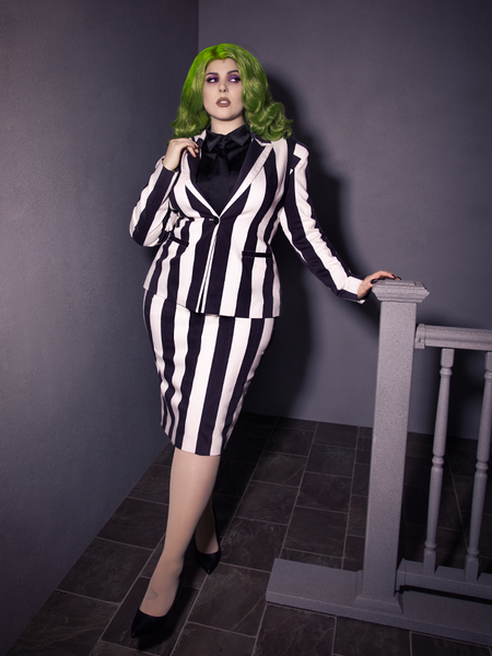 Full length shot of female model in a black and white pinstripe outfit Bowie Blouse w/Matching Tie in Black Charmeuse.