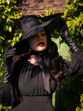Micheline Pitt modeling the Cottage Witch Hat in Black.