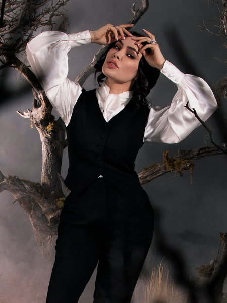 Micheline Pitt in a spooky, foggy setting wears the Victorian Blouse in Ivory from La Femme en Noir.