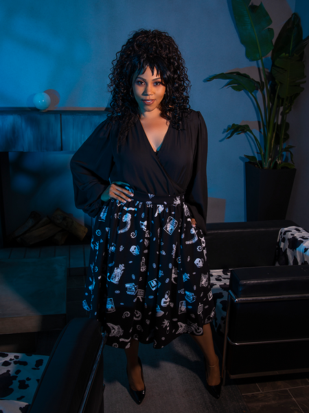 The gothic glamour clothing brand La Femme en Noir's BEETLEJUICE™ Afterlife Skirt suits this female model's beauty perfectly.