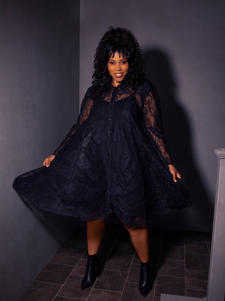 The gothic clothing brand La Femme en Noir's BEETLEJUICE™ Darkroom Dress enhances the beauty of this stunning model.