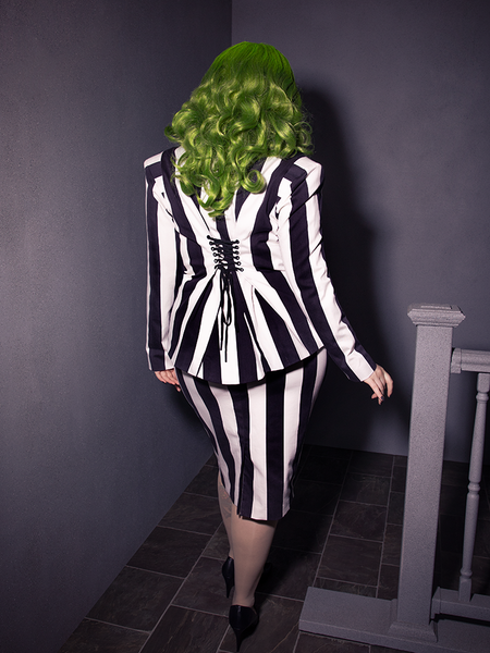 The BEETLEJUICE™ Striped Corset Blazer delivers razor-sharp style, corset details, and a hauntingly refined silhouette.