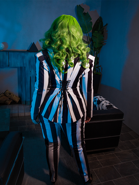 The BEETLEJUICE™ Striped Corset Blazer pairs crisp lines with edgy details, creating a hauntingly chic look for evenings that blur the lines between worlds.