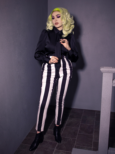 Add a playful twist to gothic fashion with the BEETLEJUICE™ Striped Pants, featuring high-contrast stripes and a striking silhouette.