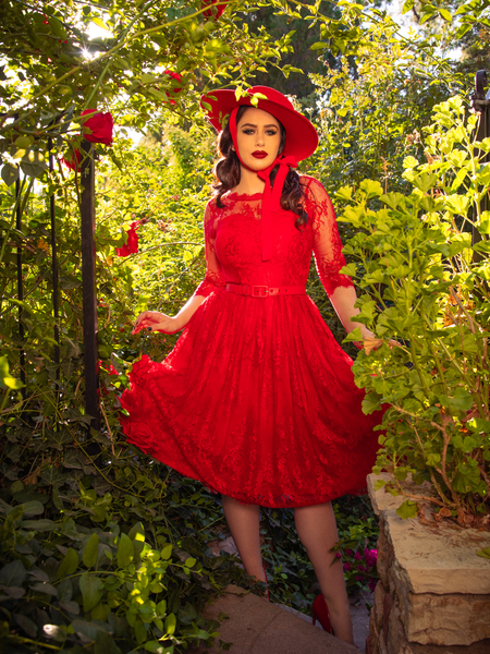 Female gently swings around the skirt section of the Mourning Dress in Crimson Lace to show off the gorgeous coloring.