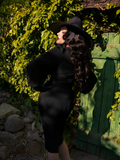 The back of the Salem Top in Black as worn by Micheline Pitt.