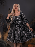 A portrait image of Micheline modeling the Sleepy Hollow™ Lady Van Tassel Guipire Lace Dress from La Femme En Noir.