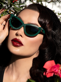 Micheline Pitt wearing the Serpent Sunglasses in Emerald Green from La Femme en Noir.