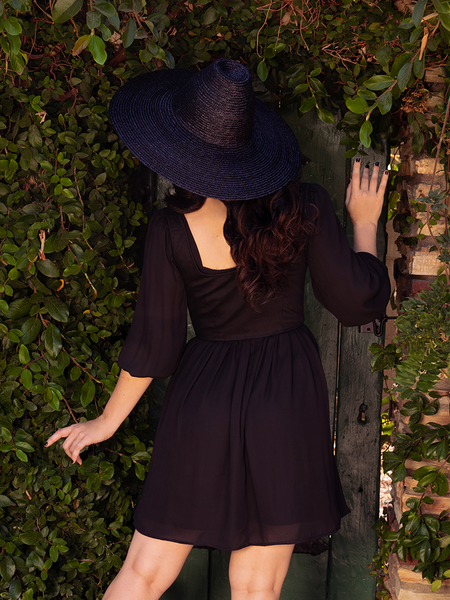 Ashley turned away from the camera to show off the back of the Cottage Corset in Black Cotton Sateen.