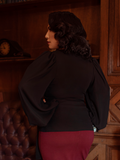 The Georgette Wrap Top in Black from La Femme en Noir.