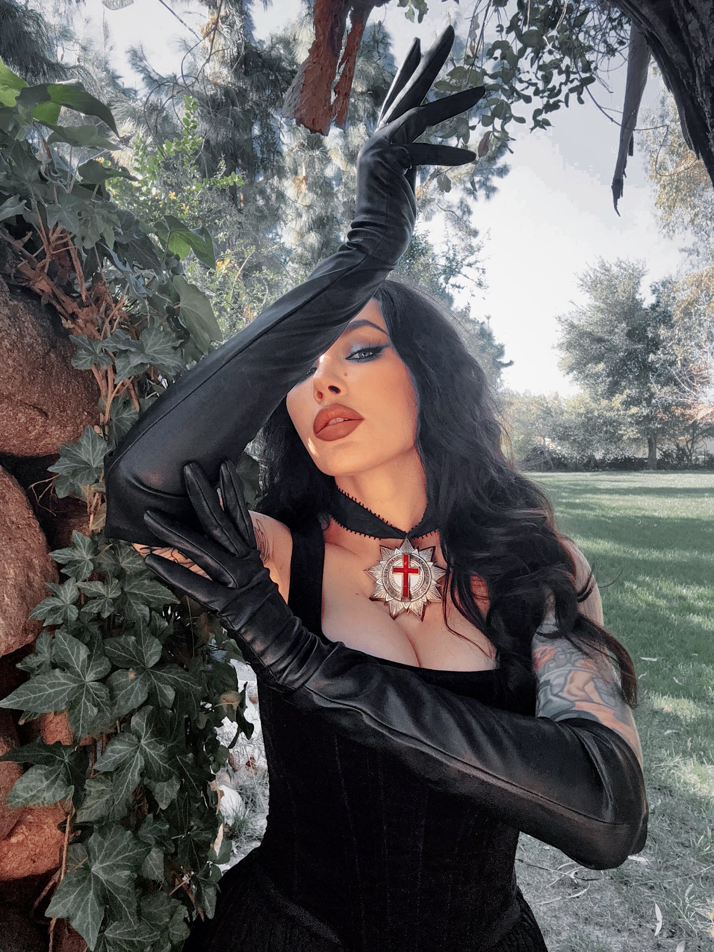 The buttery-soft vegan leather reflects a subtle, matte sheen, capturing the high-end essence of gothic glamour and sophisticated noir style.