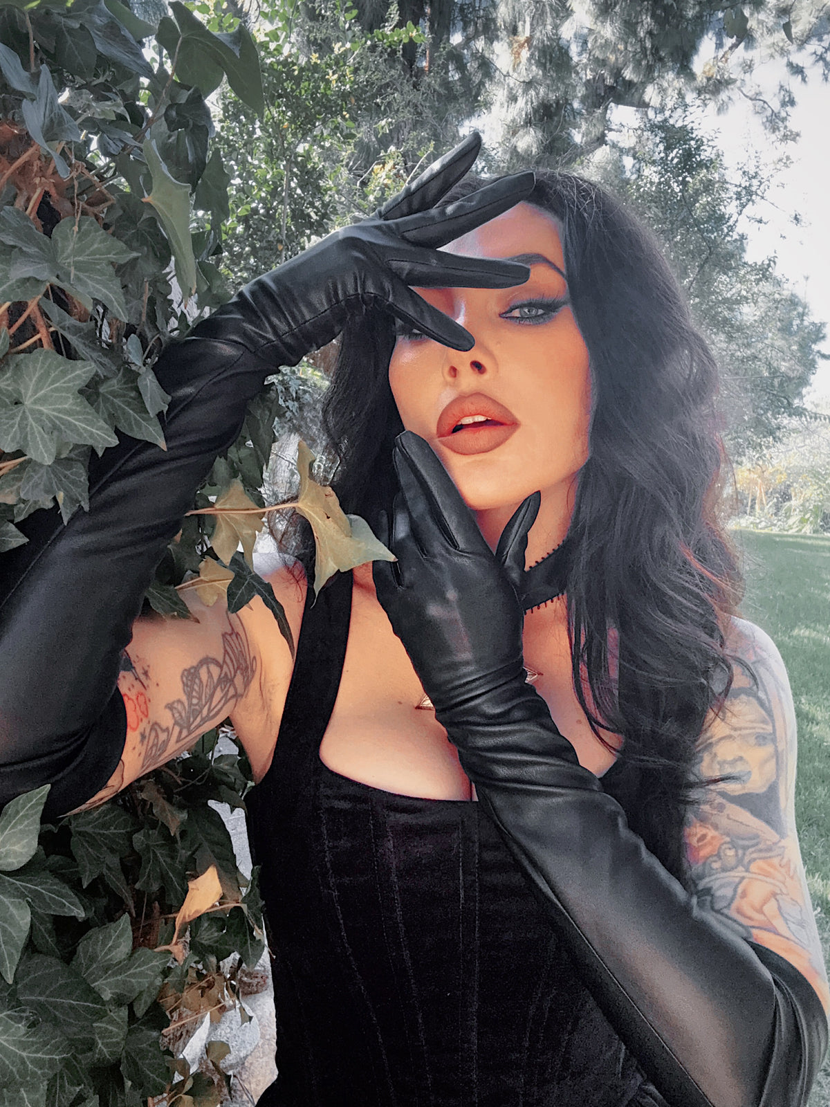 The sleek, tapered wrist emphasizes a delicate silhouette, making these opera gloves an essential for Whimsigoth layering.
