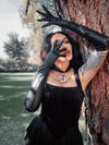 A view of the upper arm opening, designed to stay perfectly in place for a seamless transition from sleeve to glove in a darkly romantic outfit.