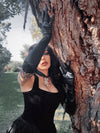 The Faux Leather Opera Gloves anchor a complete gothic glamour look, proving that true dark elegance is found in the most dramatic of details.