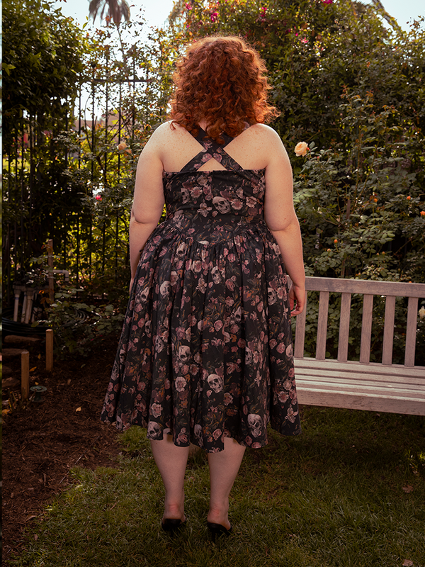 A symphony of withered blooms unfurls across the satin surface, each thread a hymn to gothic femininity.