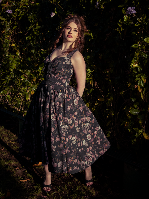 Shadows dance over silk as she turns; the Ambrosia Dress in Decayed Beauty reveals gothic glamour stitched into every ghostly petal.