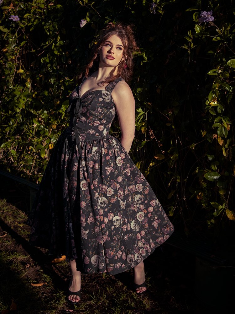 Shadows dance over silk as she turns; the Ambrosia Dress in Decayed Beauty reveals gothic glamour stitched into every ghostly petal.