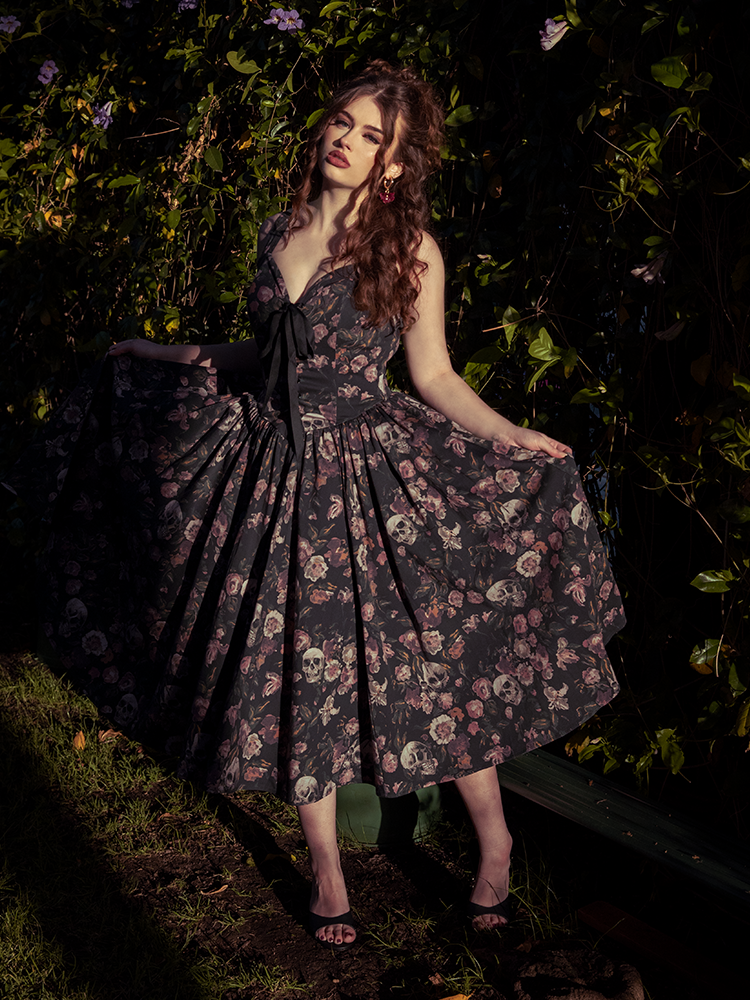 Draped in mystery, the auburn model wears the Ambrosia Dress like a relic of romance long forgotten—decay has never looked so divine.