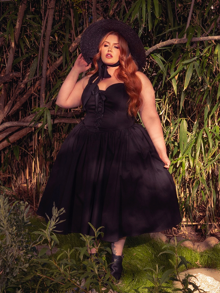 Embrace the allure of the Ambrosia Dress in Black. Its classic design and rich, dark hues evoke a sense of mystery and timeless beauty, ideal for twilight gatherings and midnight dances.