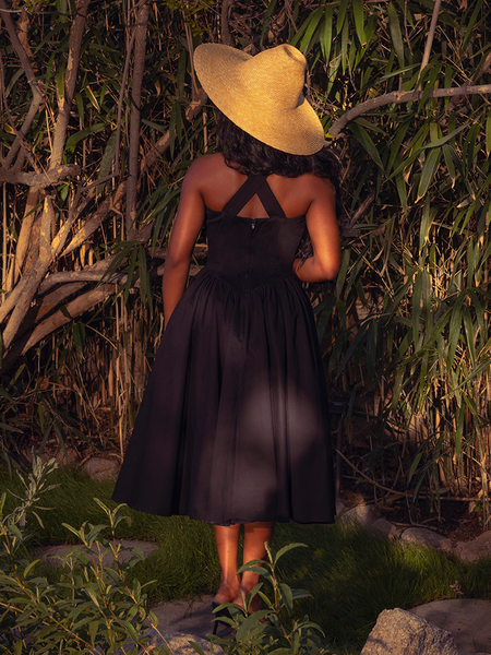 Draped in the Ambrosia Dress in Black, you'll embody the essence of gothic glamour. Its classic design and luxurious fabric create a captivating aura, ideal for twilight soirées and secret encounters.