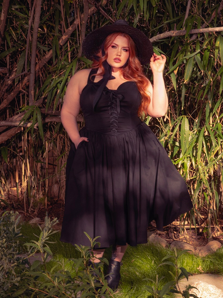 Step into the night with the Ambrosia Dress in Black. This gothic creation, with its sleek silhouette and flowing fabric, is perfect for twilight gatherings and moonlit dances.