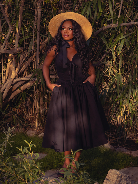 Draped in the Ambrosia Dress in Black, you'll exude gothic elegance. Its sleek silhouette and rich, dark hues create a mesmerizing aura, perfect for moonlit gatherings and enchanting nights.