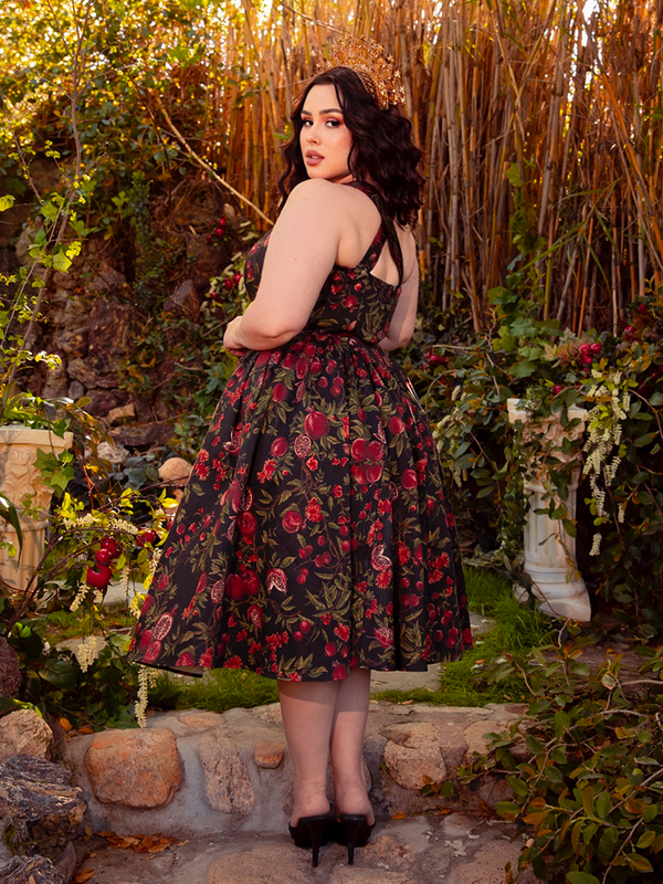 The Ambrosia Dress in Pomegranate Print is a vision of gothic allure. Its timeless design and flowing fabric evoke a sense of dark romance and mystery, ideal for candlelit evenings and whispered secrets.