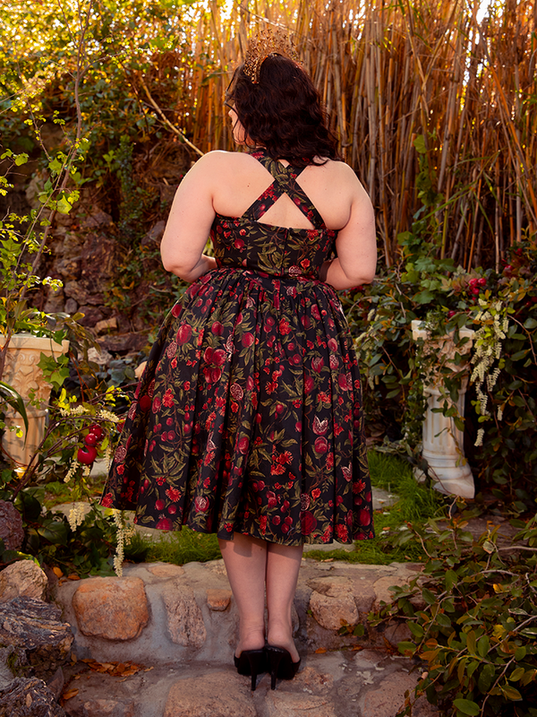 Step into timeless beauty with the Ambrosia Dress in Pomegranate Print. Its elegant silhouette and luxurious fabric create a captivating aura, perfect for twilight gatherings and moonlit dances.