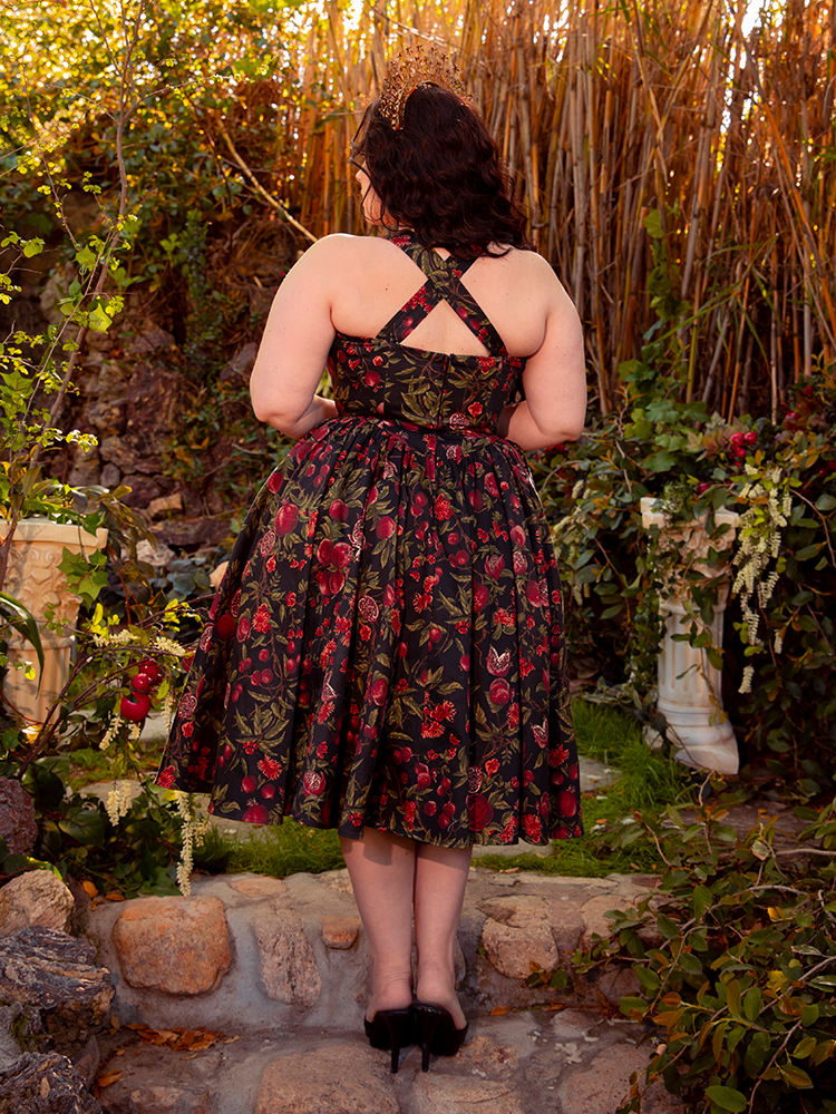 Step into timeless beauty with the Ambrosia Dress in Pomegranate Print. Its elegant silhouette and luxurious fabric create a captivating aura, perfect for twilight gatherings and moonlit dances.